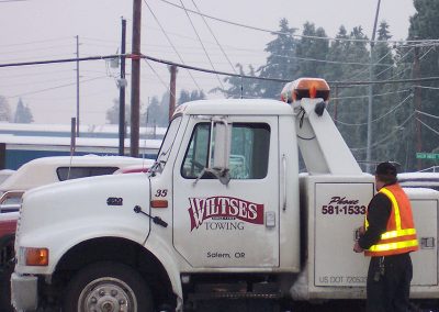 Wiltse's Towing Truck heading out to help stranded cars in the snow