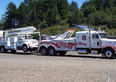 Work truck being towed by Wiltse's Towing